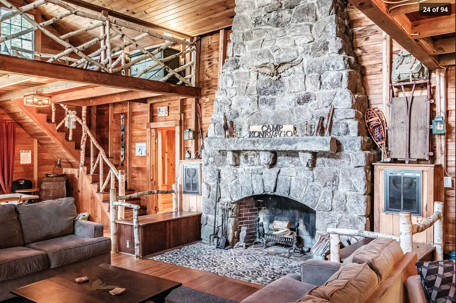 Camp Konewago's timbered great room and stone fireplace