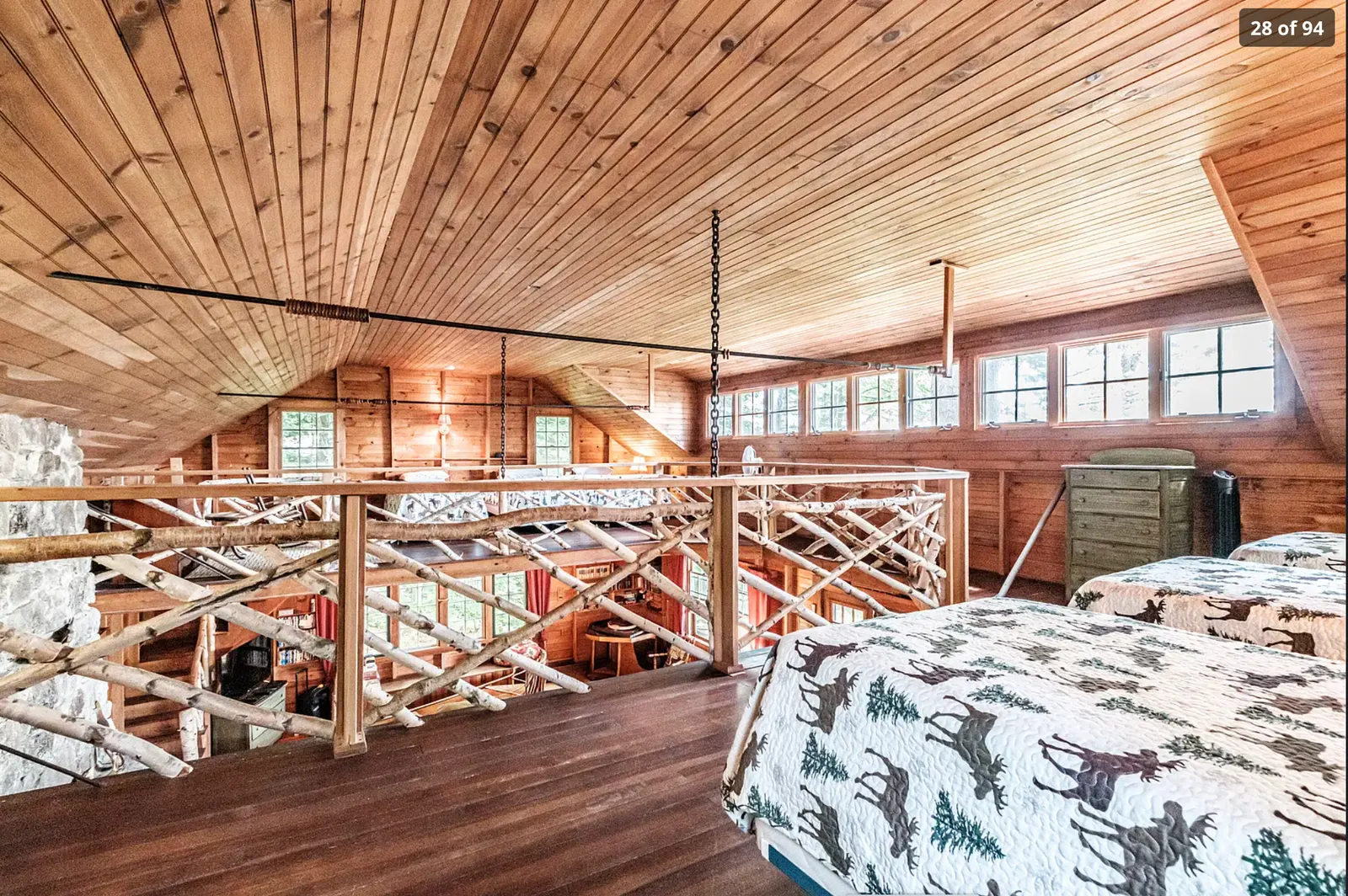 Rustic loft with beds above the great room