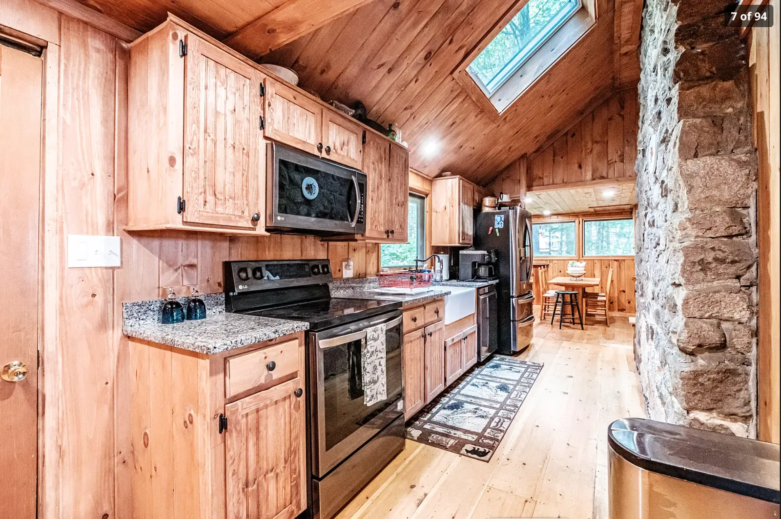 Warm pine kitchen with full appliances